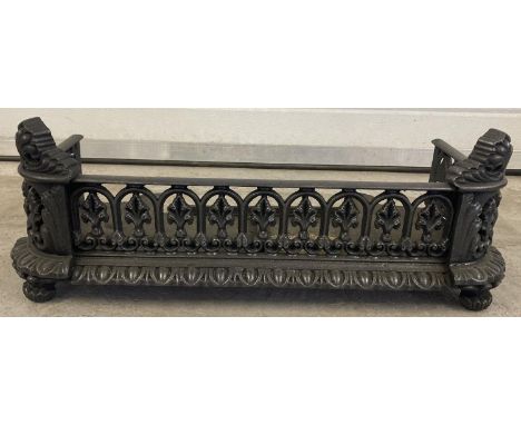 A Victorian cast iron fire grate front with decorative pierced galleried sides. Approx. 22cm tall x 58cm long. 