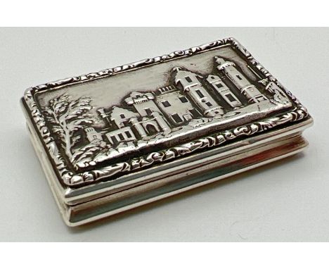 A William IV silver Castle Top vinaigrette featuring a view of Abbotsford House in relief. Fully hallmarked to interior of li