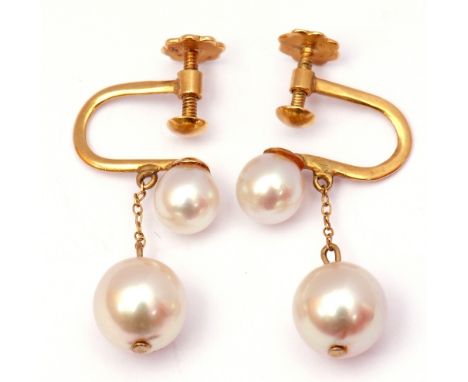 Pair of 18ct stamped pearl drop earrings featuring two graduated natural pearls, the larger drop 6mm approx, screw fittings