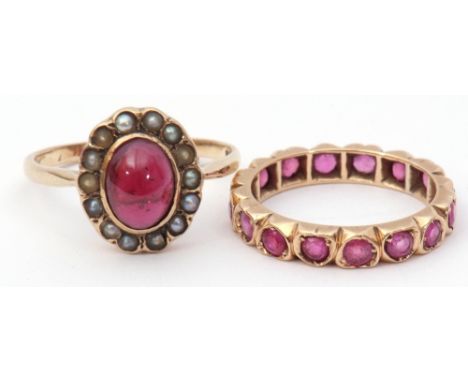 Mixed Lot: 9ct gold garnet and seed pearl dress ring, size O, together with a yellow metal ruby set eternity ring, size K/L