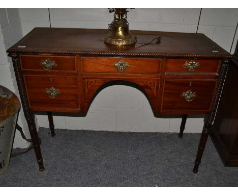 A group of furniture comprising an Edwardian centre table, a Georgian commode (converted to a bedside), an Edwardian occasion