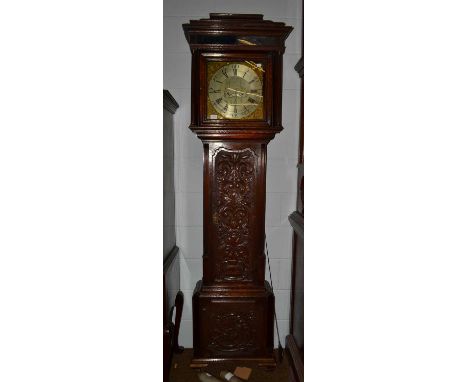 An oak eight-day longcase clock, dial inscribed Major Scholfield, Salford, later carved case, later eight-day movement, 