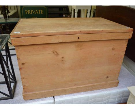 A Victorian pine trunk with a hinged lid, together with a large wicker basket.