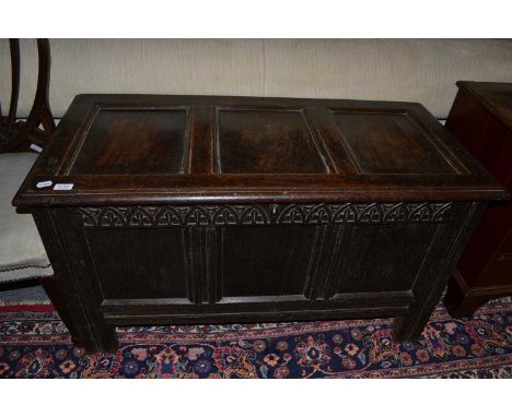 A 19th-century three-panel oak coffer, 113cm by 54cm by 63cm