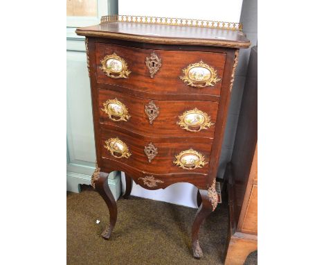 An Early 20th Century Mahogany and Gilt Metal Mounted Commode, in Louis XV style, the pierced three-quarter gallery above thr