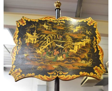 A Regency Ebonised and Parcel Gilt Pole Screen, early 19th century, the chinoiserie decorated panel with figures in a landsca