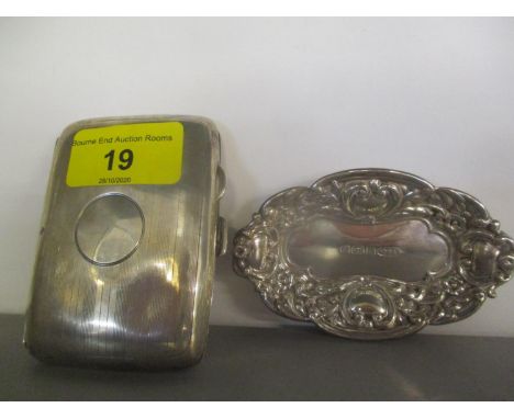 An early 20th century silver cigarette case, together with a silver embossed trinket dish, 84.9g 