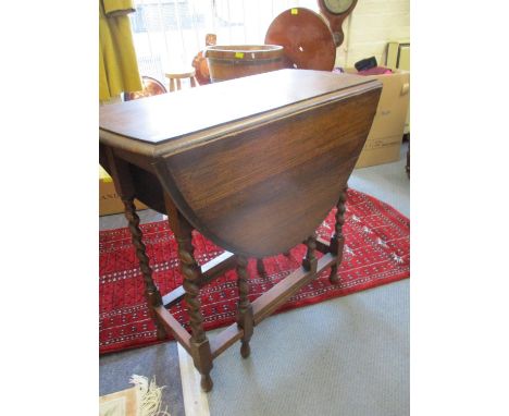 A 1930s oak gate leg table on barleytwist legs, 76cm w 