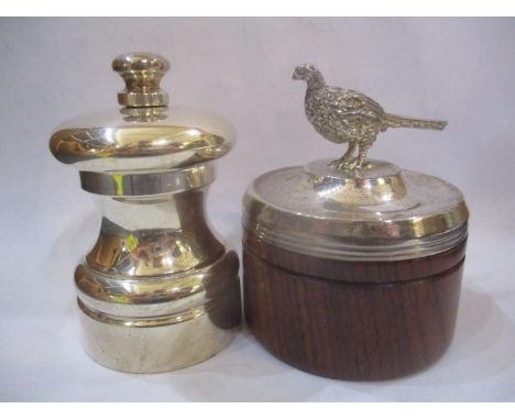 A silver Peter Piper pepper grinder and a silver lidded wooden pot with a pheasant finial 