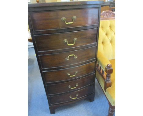 Circa 1900 a mahogany bow fronted chest of six drawers on ogee bracket feet