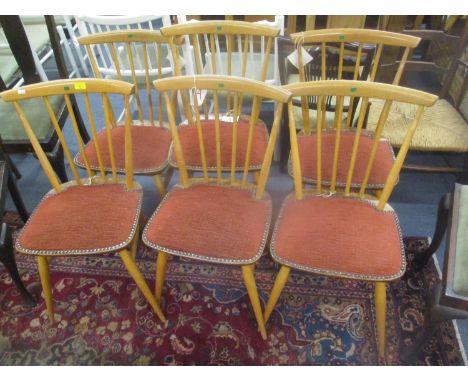 A set of six vintage Ercol blonde elm and beech stick back dining chairs with later padded seats 