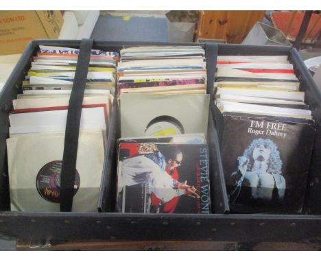 Over 250 7"singles in a black leather DJ's carry case to include The Who, Dr, Def Leppard, Wizard, Elvis and others 