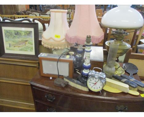 A group of table lamps, one converted to electricity from an oil lamp with milk glass shade, together with a vintage Bush rad