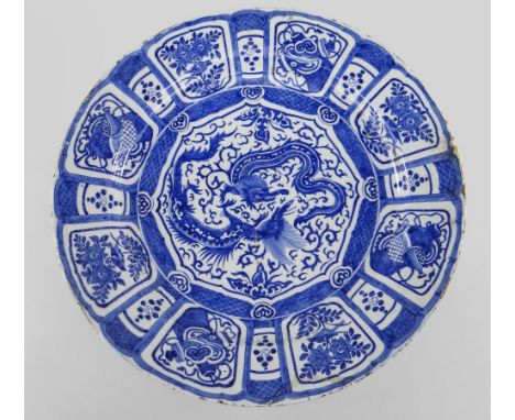 LARGE DUTCH DELFT 'KRAAK' STYLE BLUE &amp; WHITE CHARGER, c. 1700,  painted in the Chinese style with two confronting dragons