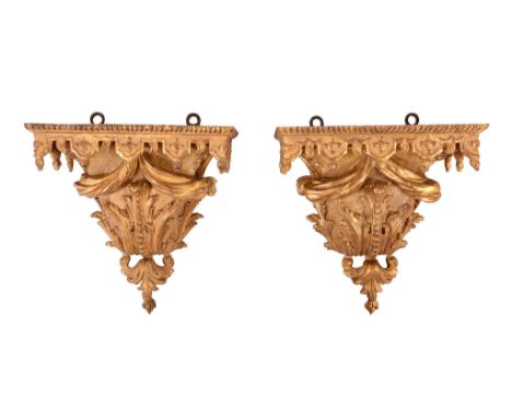  A Louis XV carved giltwood bracket  , circa 1755, the rectangular top with gadroon and lambrequin border and hung with a lar
