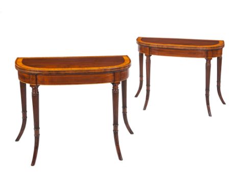 Ω A pair of George III 'D' shaped mahogany and inlaid card tables , circa 1800, the tops with satinwood and rosewood crossban