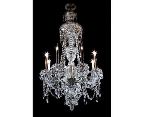  An English cut-glass eight light chandelier  , circa 1880, the upper canopy and cup both with fan-cut scalloped rims hung wi