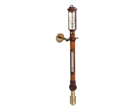 Ω A Victorian carved and veneered walnut marine barometer by Cowland & Son , late 19th century, with a bow-fronted case with 