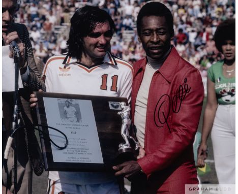A large colour portrait photograph of Pele and George Best,signed in black marker pen on the front and accompanied by a certi