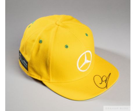 Lewis Hamilton signed yellow and green (Brazil inspired) Mercedes AMG Petronas Motorsport cappeak signed, the underside featu