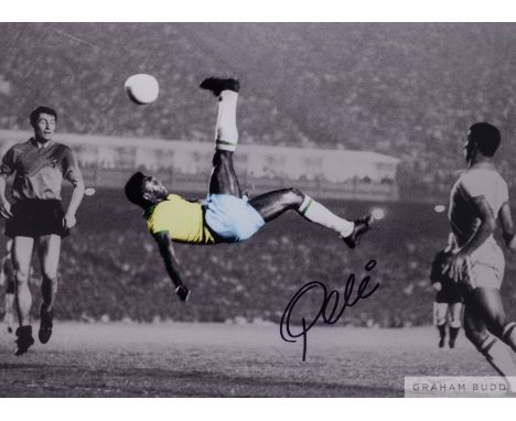 A large colour and black and white portrait photograph of Pele, signed in black marker pen on the front by Pele and accompani
