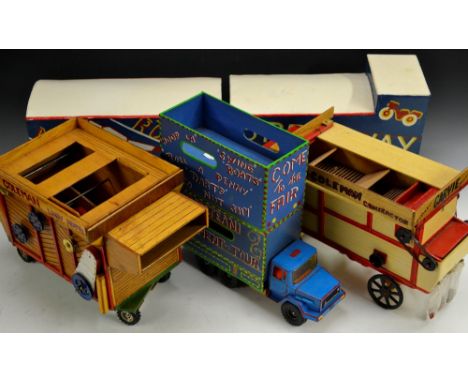A scratch built model of a fairground trailer Moonrocket;  another Speedway;  a smaller wagon and trailer, Denjeni Amusements