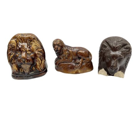 Two 19th century treacle glaze furniture/sash window rests modelled as lions, tallest example H12.5cm, together with a 19th c