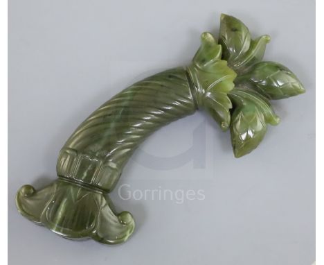 A Mughal spinach jade dagger handle, carved with spiral fluted grip and foliate base, 5.75in.