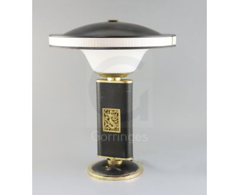 An Eileen Gray 'Sirene' embossed metal and plastic desk lamp, manufactured by Jumo, France, height 17in.