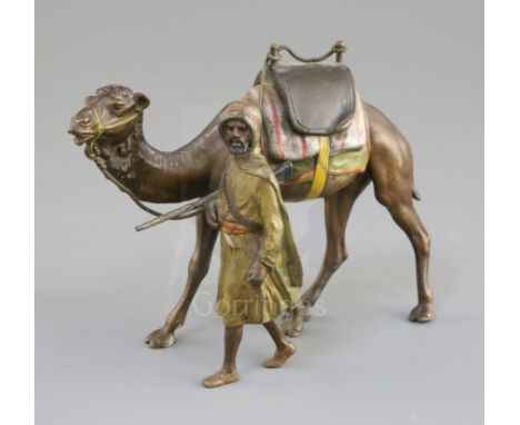 A late 19th / early 20th century Austrian cold painted bronze model of an Arab warrior walking alongside his camel, 6in.