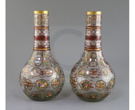 A pair of Bohemian Ottoman Market glass bottle vases, late 19th century, each enamelled and ruby flashed with panels of fish 