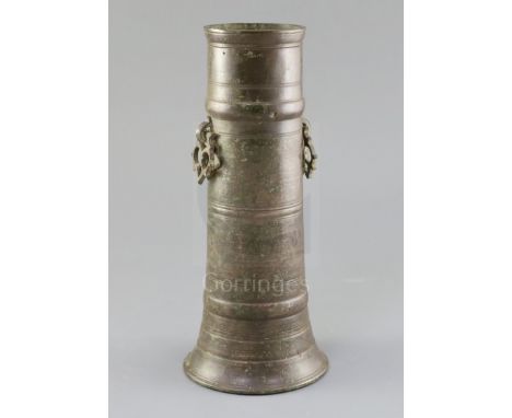 A 17th century Indian bronze vase, with pierced ring handles and ring turned decoration, lacks base, height 12in.