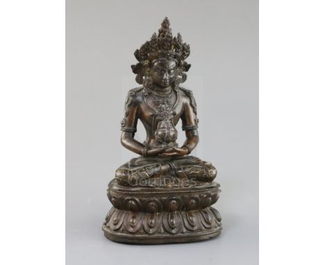 A Tibetan silver and gold inlaid copper alloy figure of Amitayus/Amitabha, c.15th century, seated in dhyanasana on a double-l