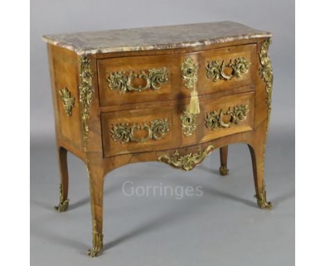 A Louis XV style ormolu mounted kingwood serpentine commode, with rouge marble top and two drawers, on cabriole legs, W.3ft 1