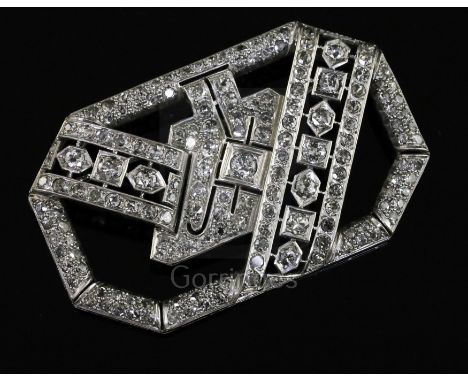 A 1950's/1960's Art Deco style platinum? and diamond set openwork brooch, of rectangular form with canted corners, 57mm.
