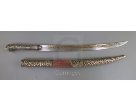 A 19th century Indian silver mounted dagger, with inscribed damascened steel blade, the hilt and scabbard decorated with pane