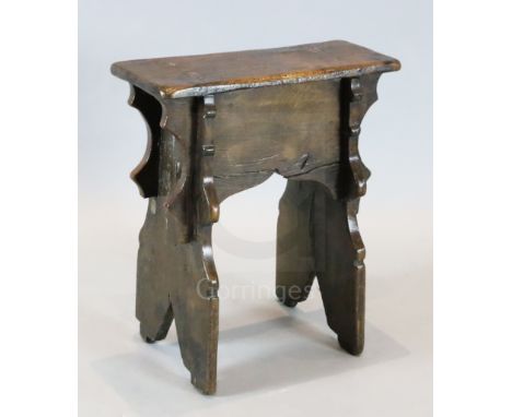 An early 17th century boarded oak stool, 1ft 7.5in. x 8.5in. H.1ft 10.5in.