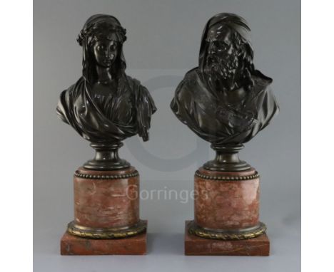 A pair of 19th century French bronze busts of a bearded man and woman wearing a laurel wreath, on ormolu mounted rouge marble