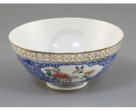 A Chinese famille rose bowl, late 19th century/early 20th century, painted to shaped reserves with birds, flowers, a lantern 