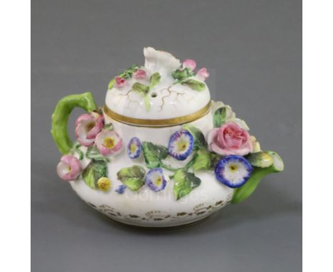 A Rockingham porcelain miniature teapot and cover, c.1830-42, encrusted with flowers, puce griffin mark, iron red mark 'CL2',