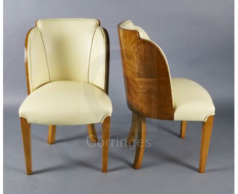 A set of six Art Deco tiger maple cloud back dining chairs, with cream leather upholstery on square legs, W.1ft 9in. D.2ft H.