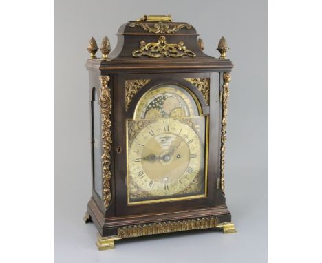Francis Dorrell of London. A George III stained pearwood and ormolu repeating bracket clock, the arched brass dial with paint