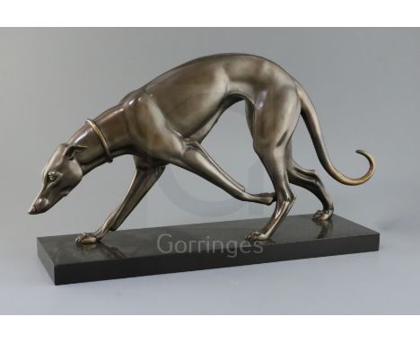 Attributed to Irene Rochard. An Art Deco bronze model of a greyhound, on black marble plinth, length 22in.