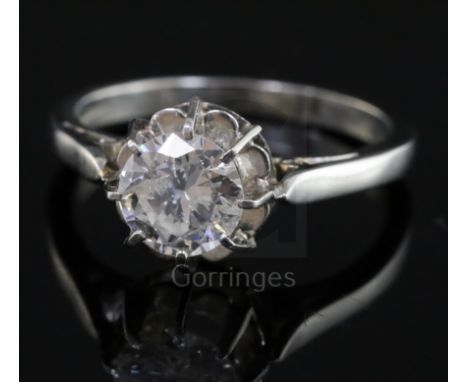 A platinum and solitaire diamond ring, the round cut stone weighing approximately 1.00ct, size K.