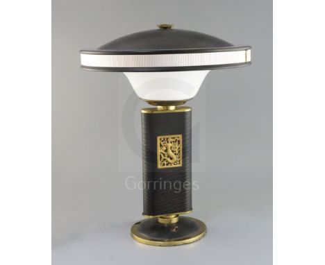 An Eileen Gray 'Sirene' embossed metal and plastic desk lamp, manufactured by Jumo, France, height 17in.