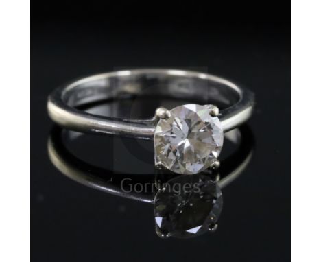 A modern 18ct white gold and solitaire diamond ring, the round brilliant cut stone measuring approximately 6.35mm in diameter