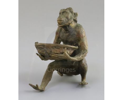 A late 19th century Franz Bergman cold painted bronze model of a monkey holding a walnut shell, initialled FB and stamped Ges