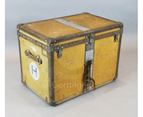 A 1920's Louis Vuitton travelling trunk, upholstered in orange tan canvas, original canvas lined interior with two lift out t