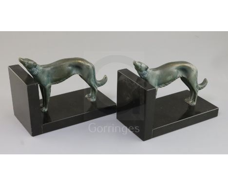 Constant Roux. A pair of bronze and black marble bookends, modelled with standing borzoi, 7in. height 5.5in.