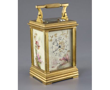 An early 20th century ormolu and porcelain hour repeating carriage clock, the dial and side panels painted and gilded with bi